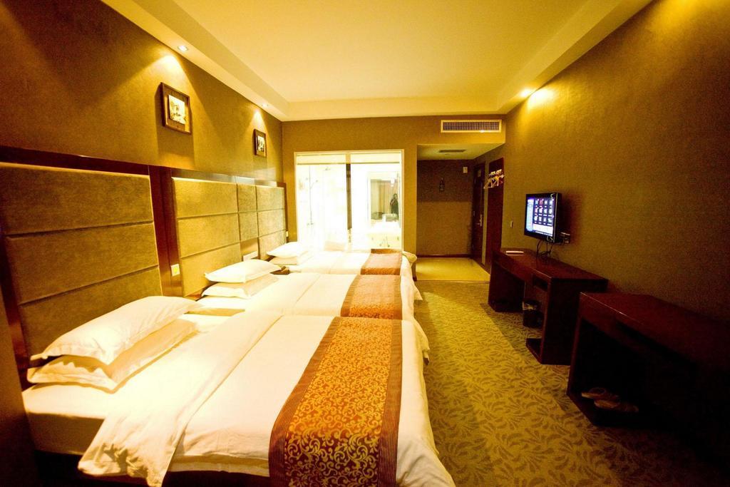 Omeiga Business Hotel Nghĩa Ô Phòng bức ảnh